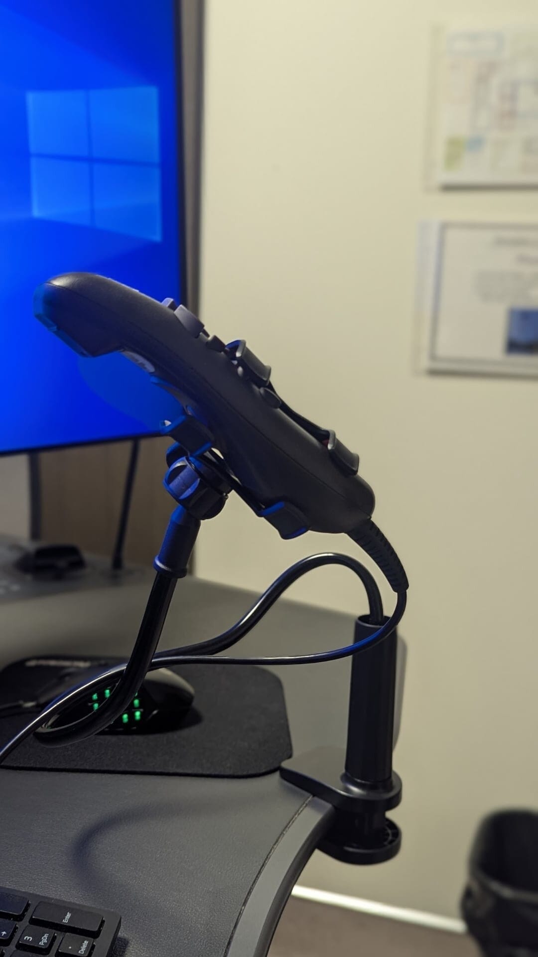 Side view of adjustable screw clamp base on a gooseneck arm used as a hands-free PowerScribe dictation microphone holder