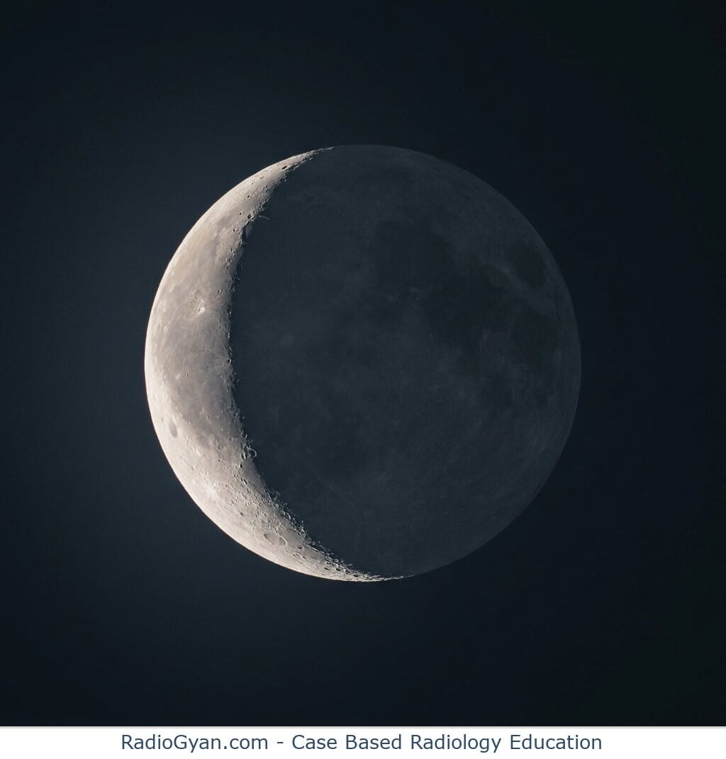 A slim, curved crescent of pale light hugging the left edge of the round moon, illustrating the moon-like shape that gives the air crescent sign its name.