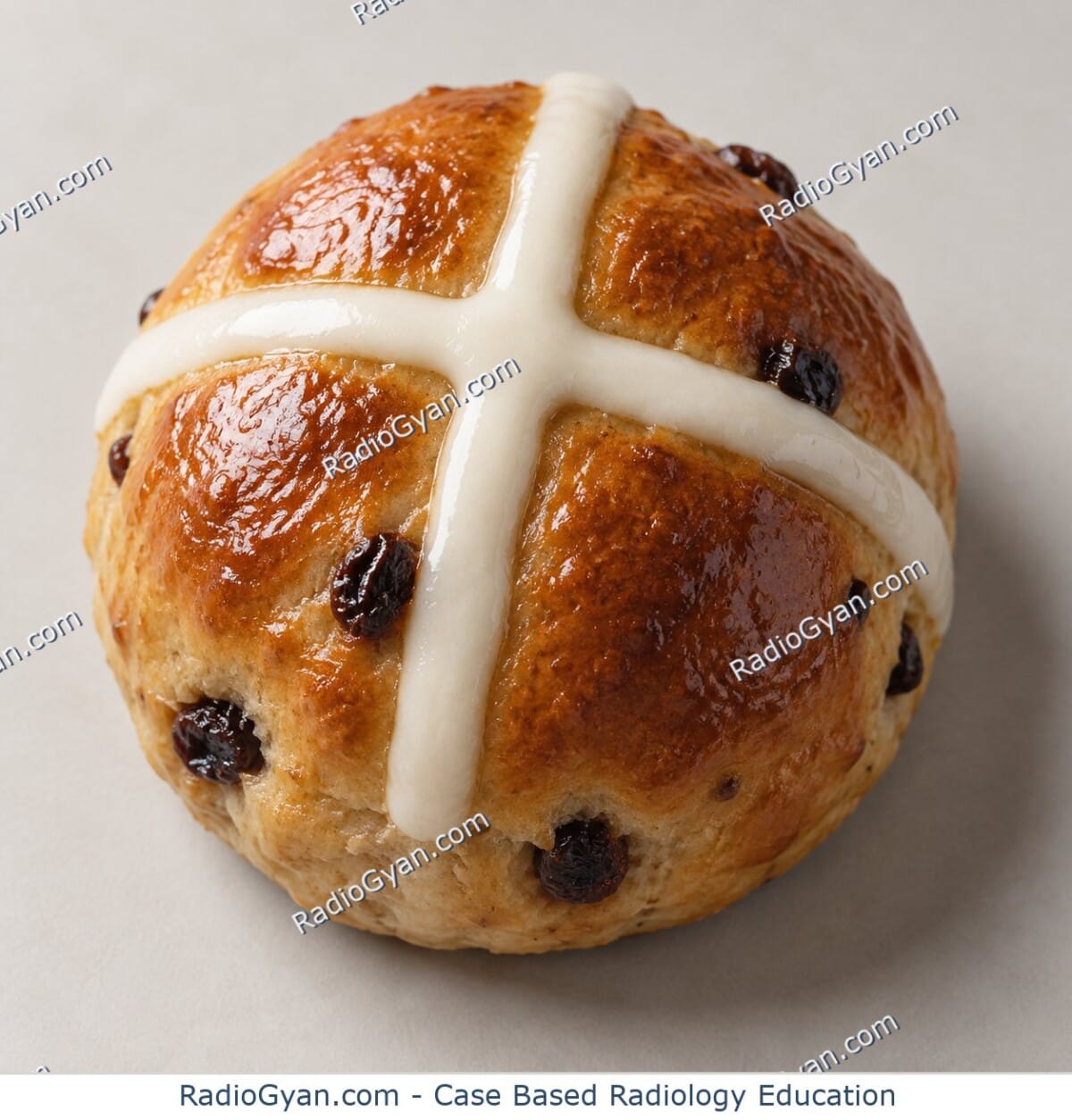 A golden-brown hot cross bun with a white icing cross piped across its rounded top, illustrating the origin of the hot-cross bun sign.