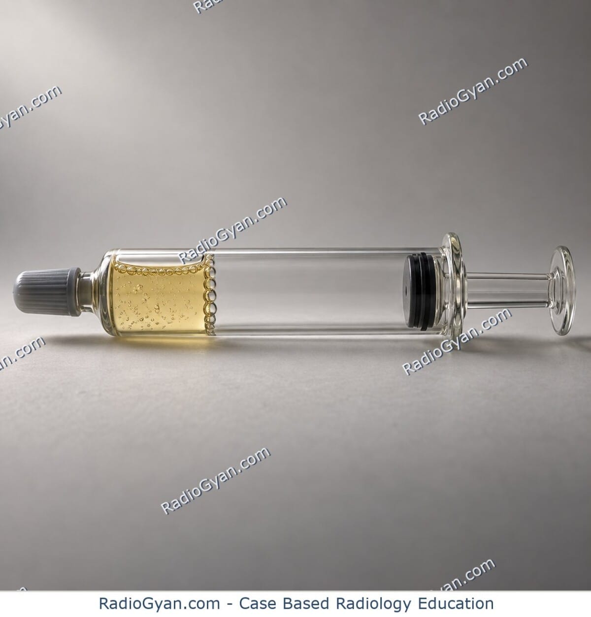A capped glass syringe with its plunger drawn back, gas bubbles rising in the straw-coloured liquid and an emptied gap in the barrel, illustrating the vacuum joint sign.